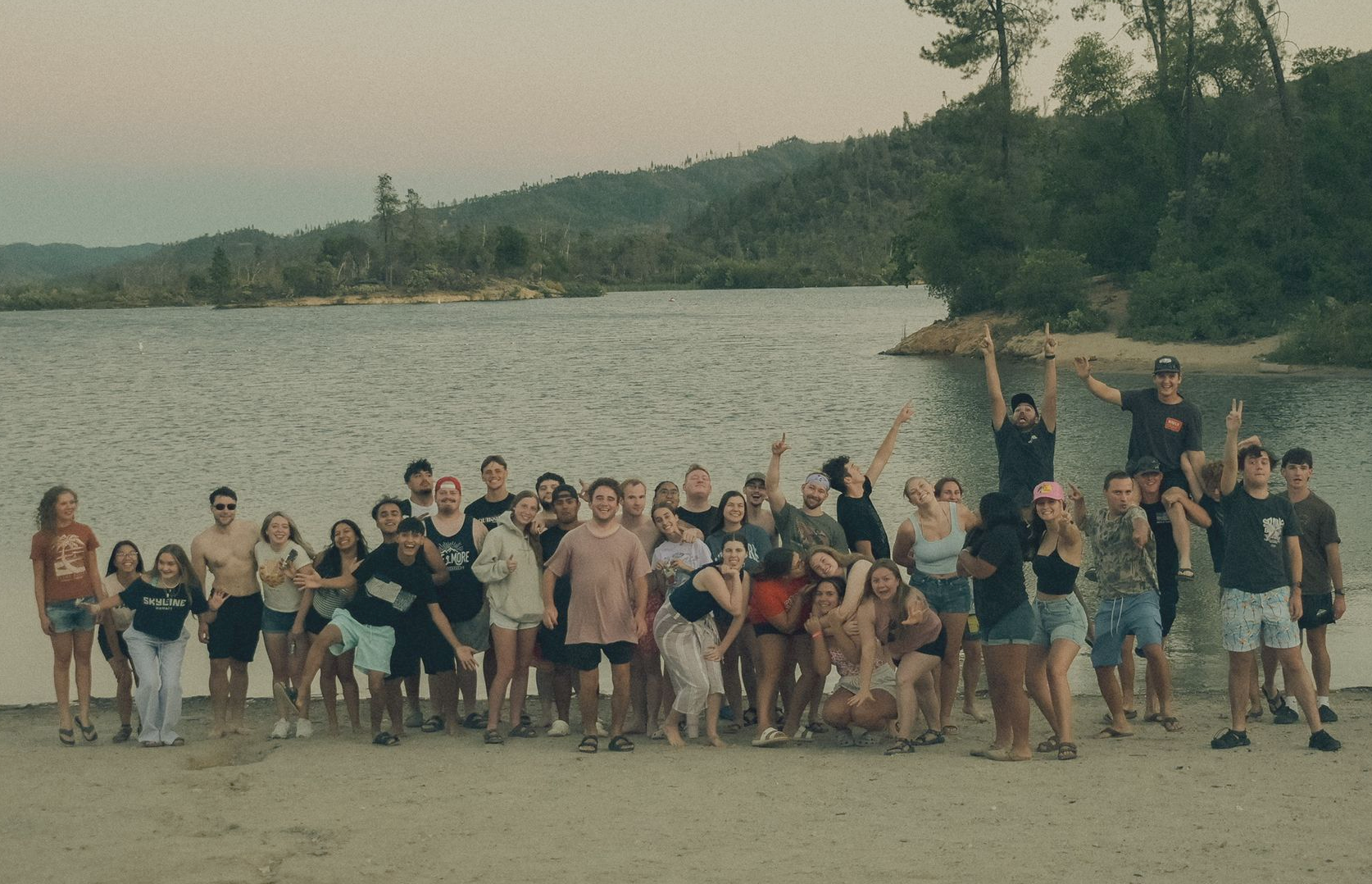 group of young adults by the lake
