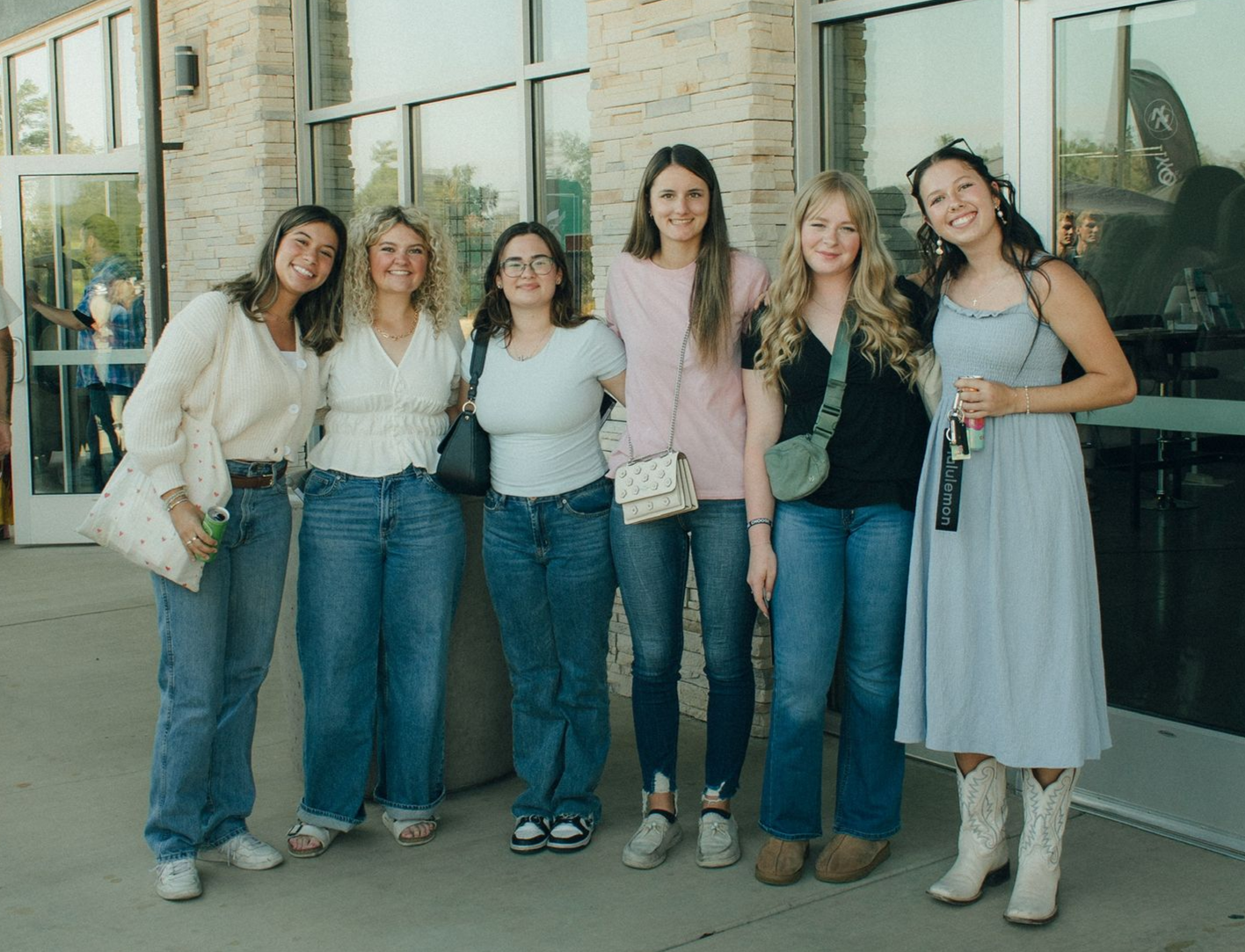 group of girls lined up and smiling