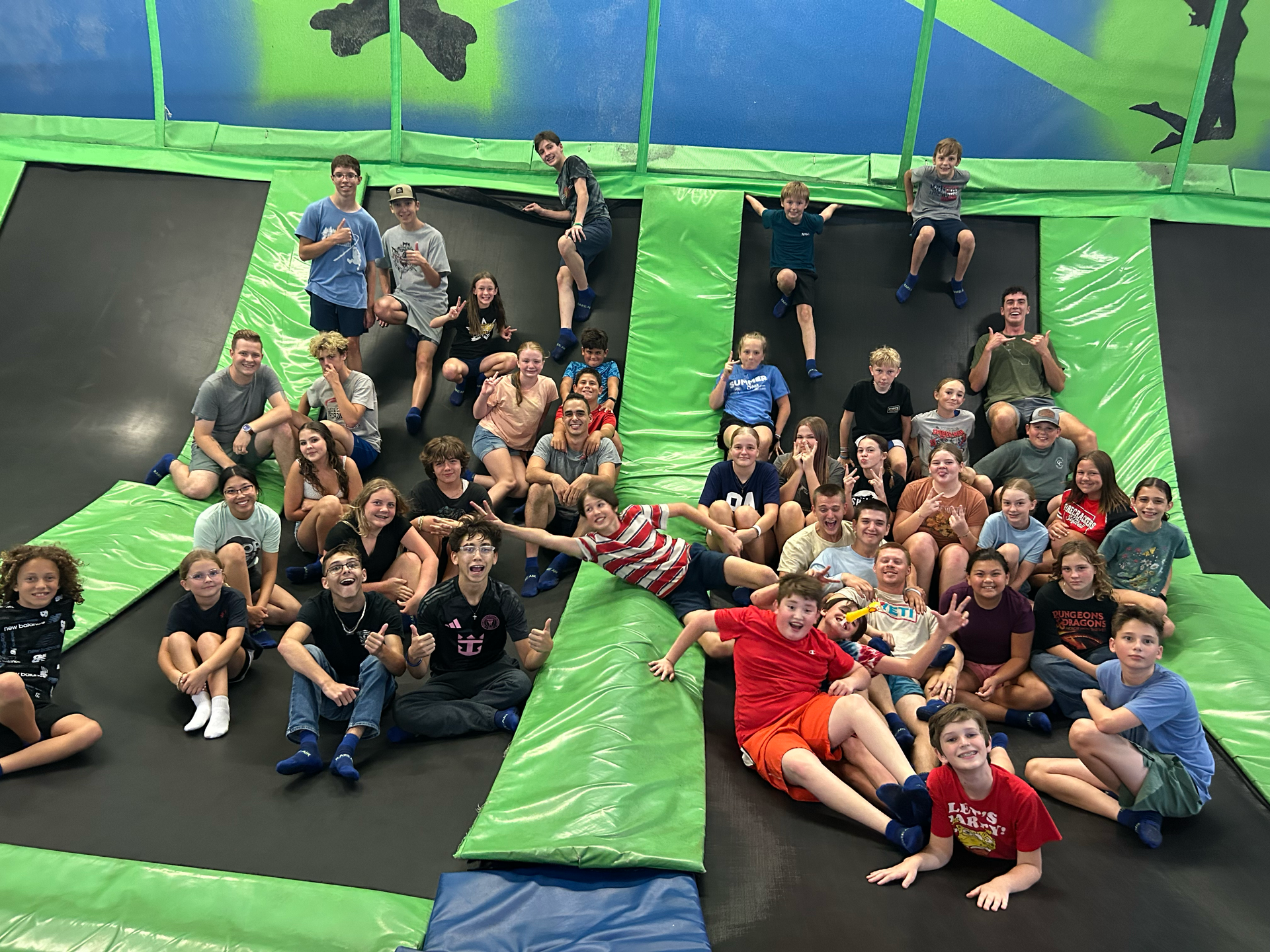 Group of junior high kids at trampoline park.