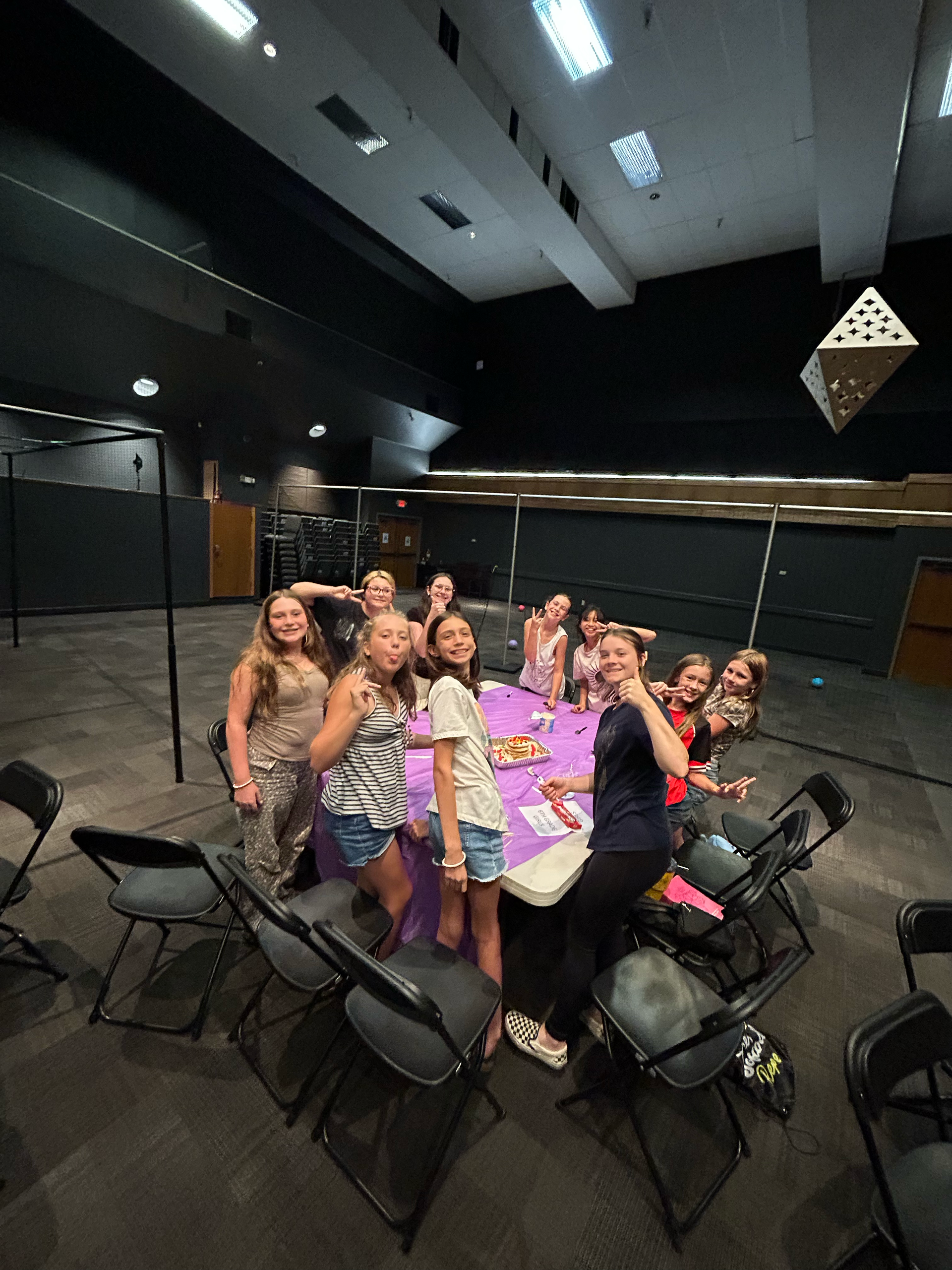 Group of young junior high students smiling.