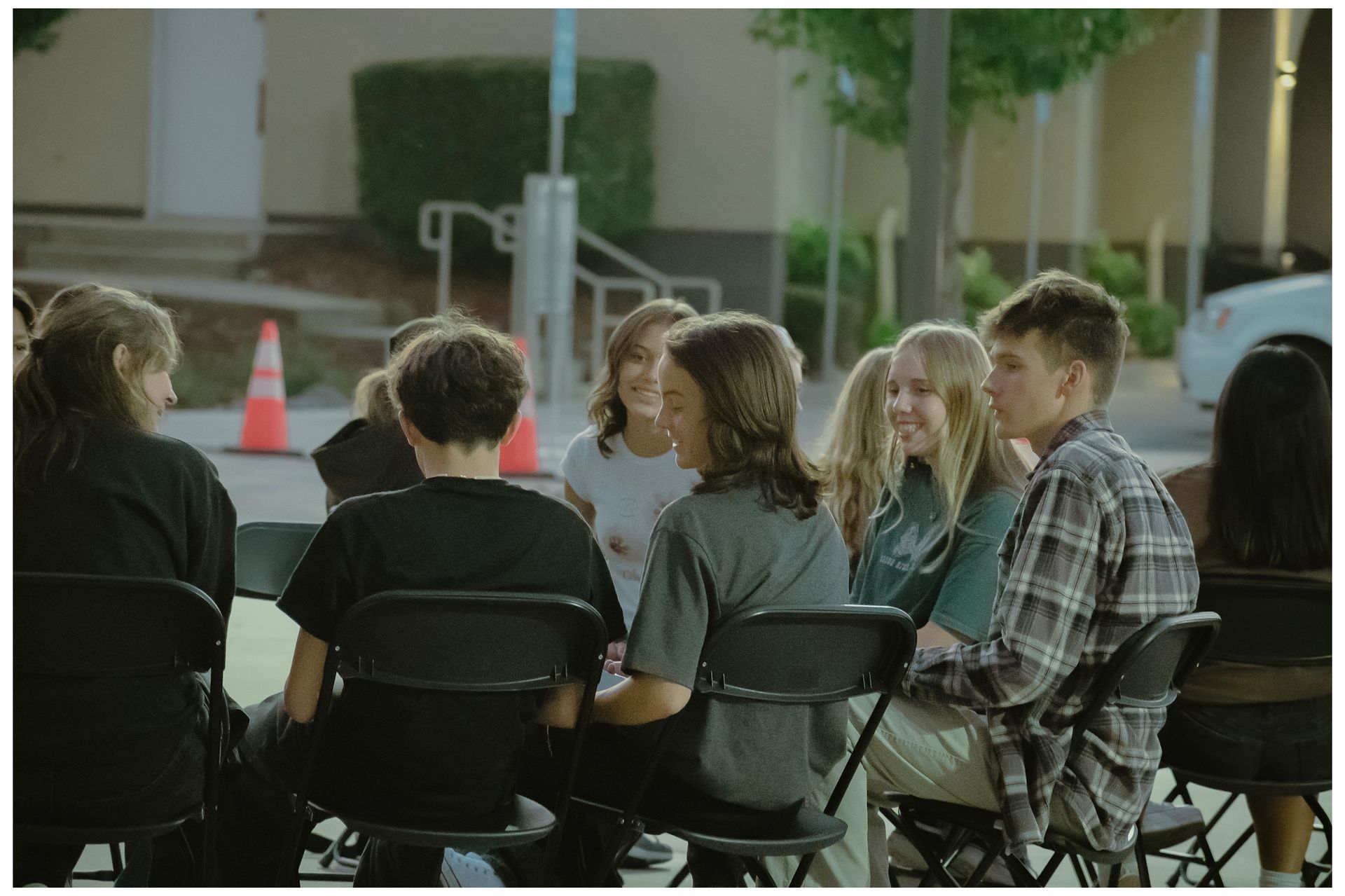 teenage students sitting and talking