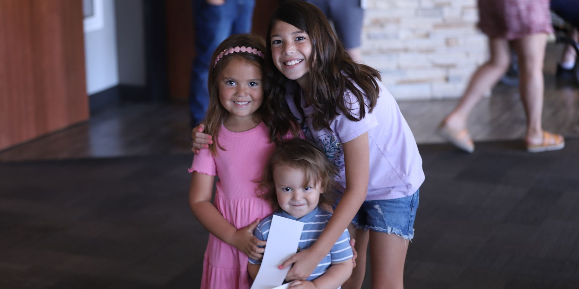 group of three cute smiling kids