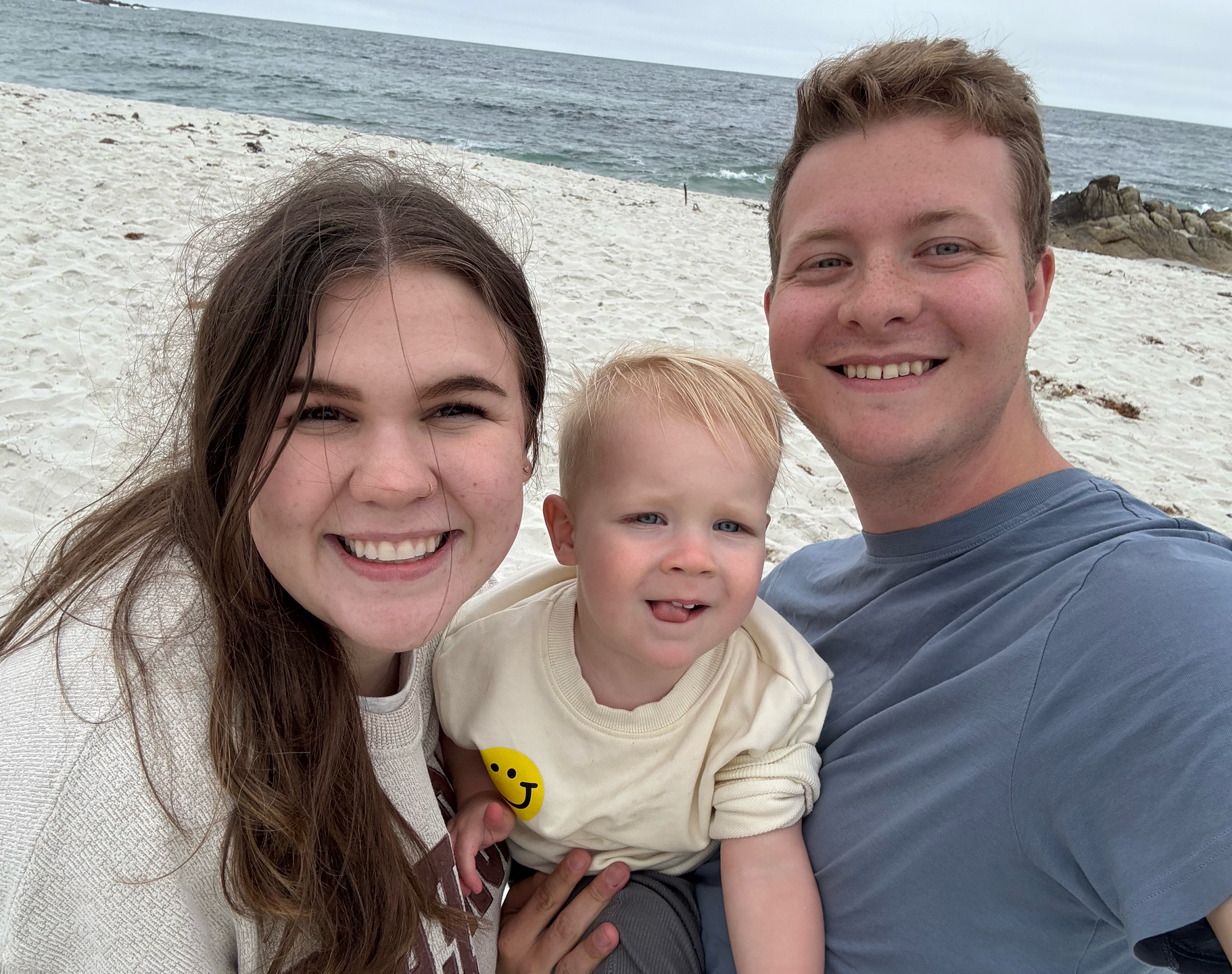 smiling parents with a toddler