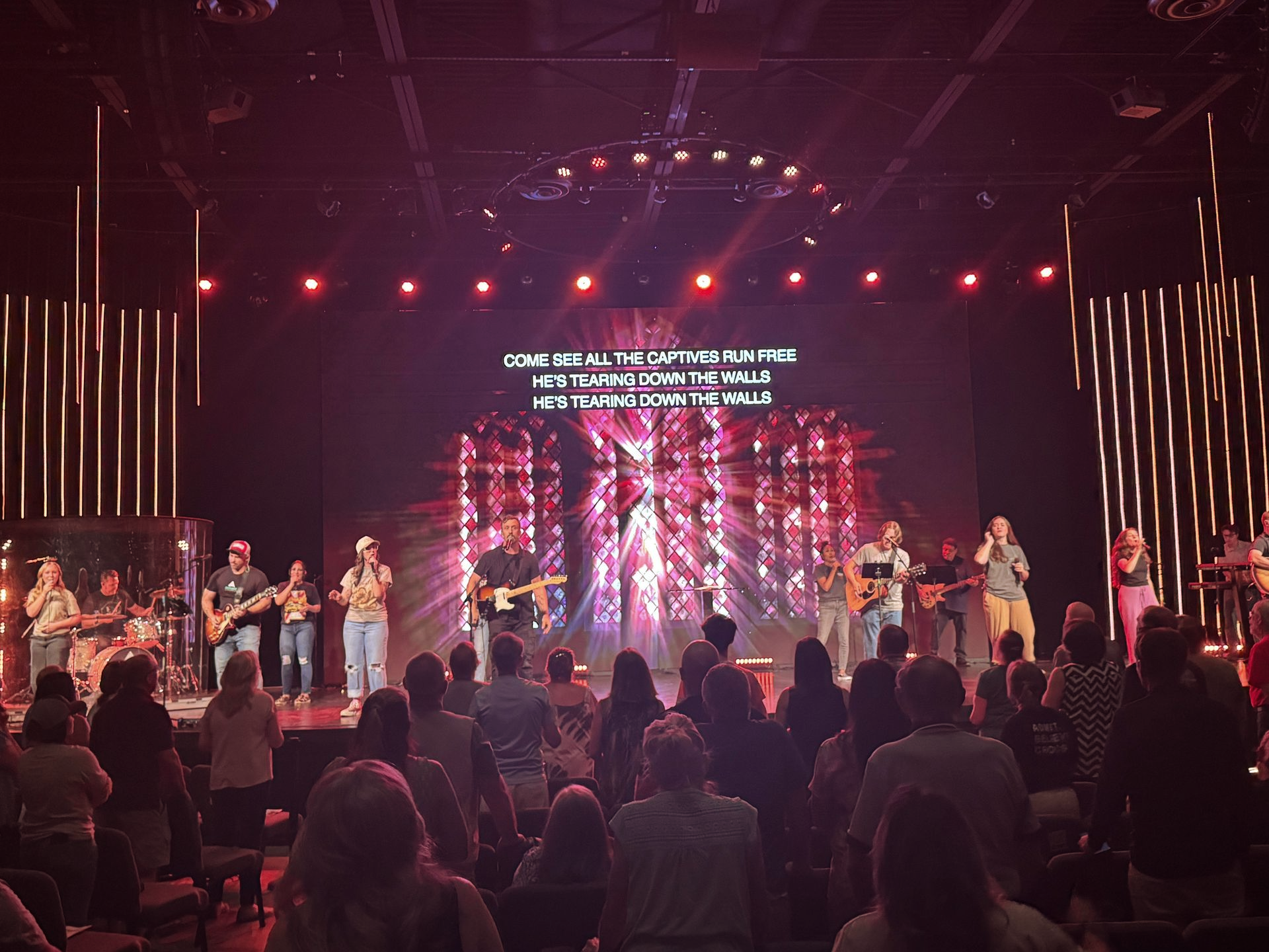 group of people singing on stage