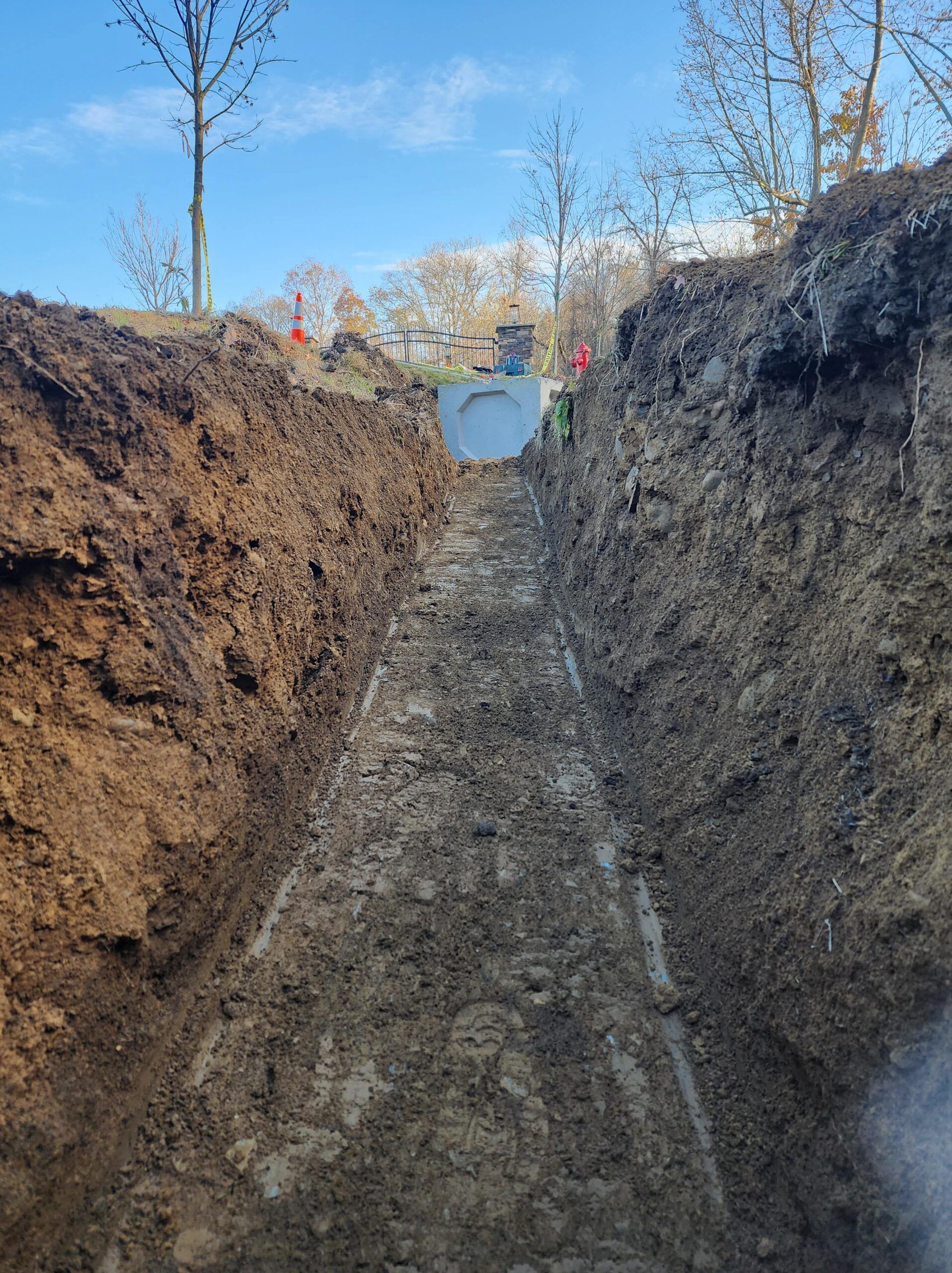 A large hole in the ground with a pipe in it.