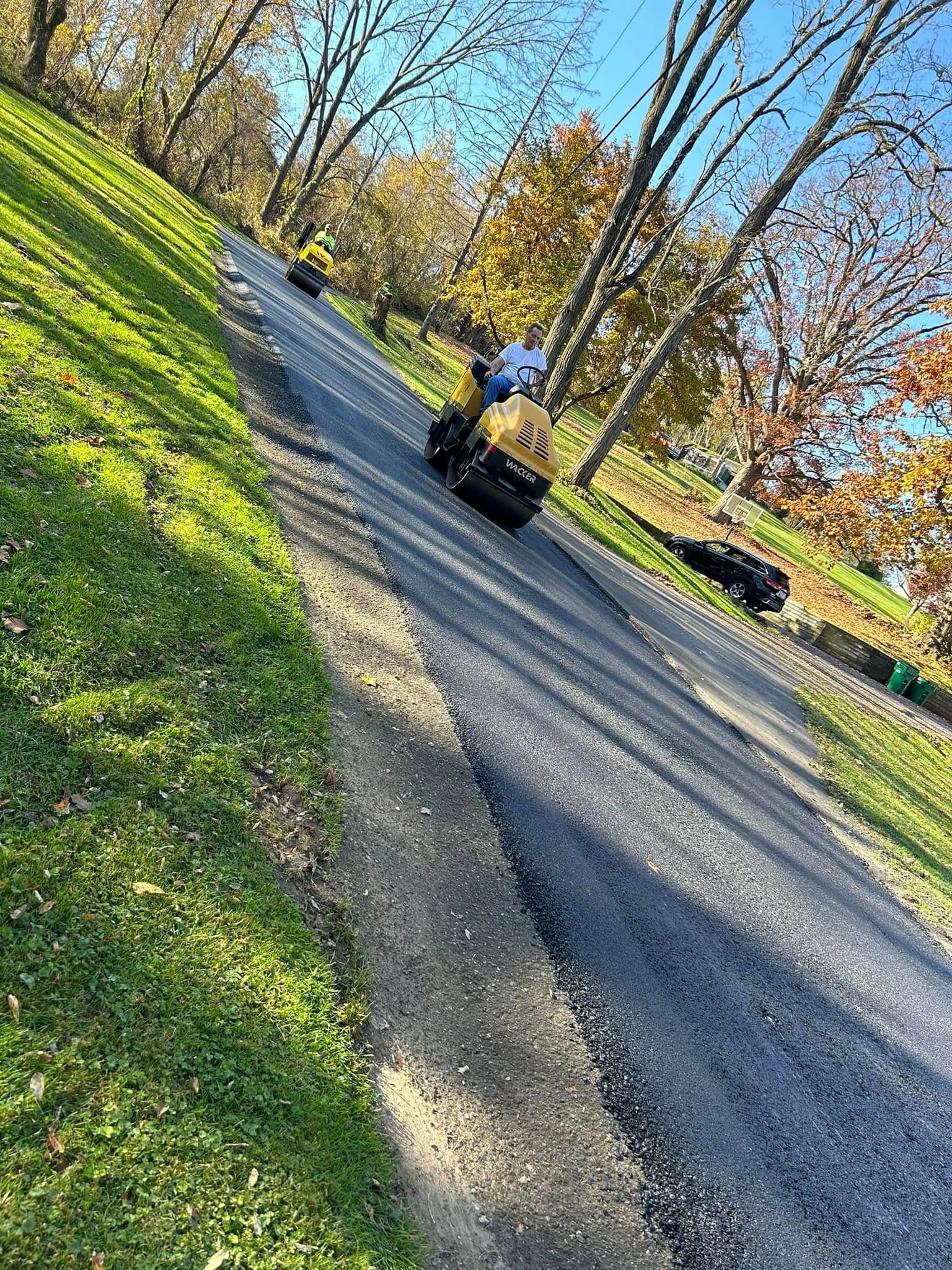 A person is riding a golf cart down a hill.