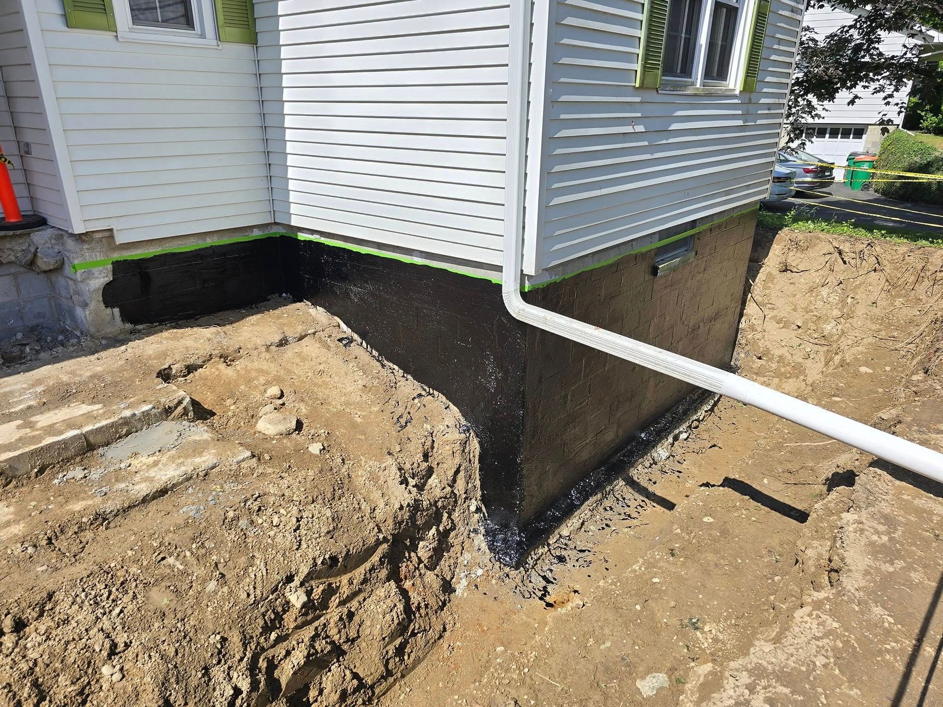 A house with a drain pipe coming out of it