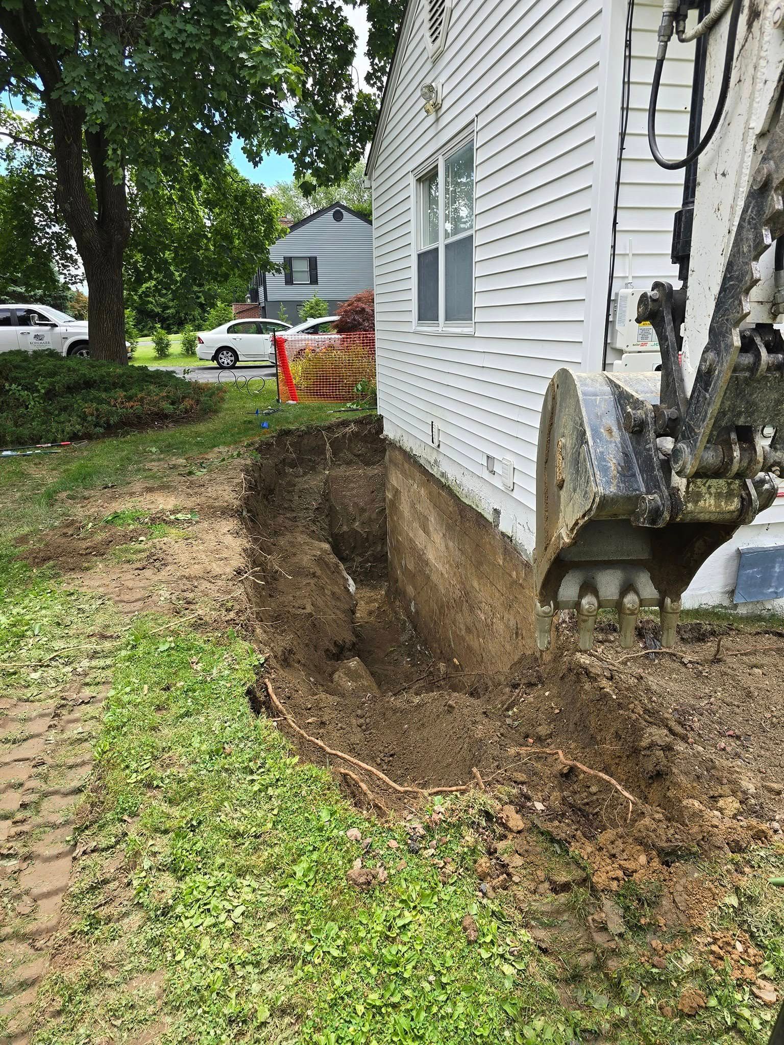 A white house with a hole in the side of it.