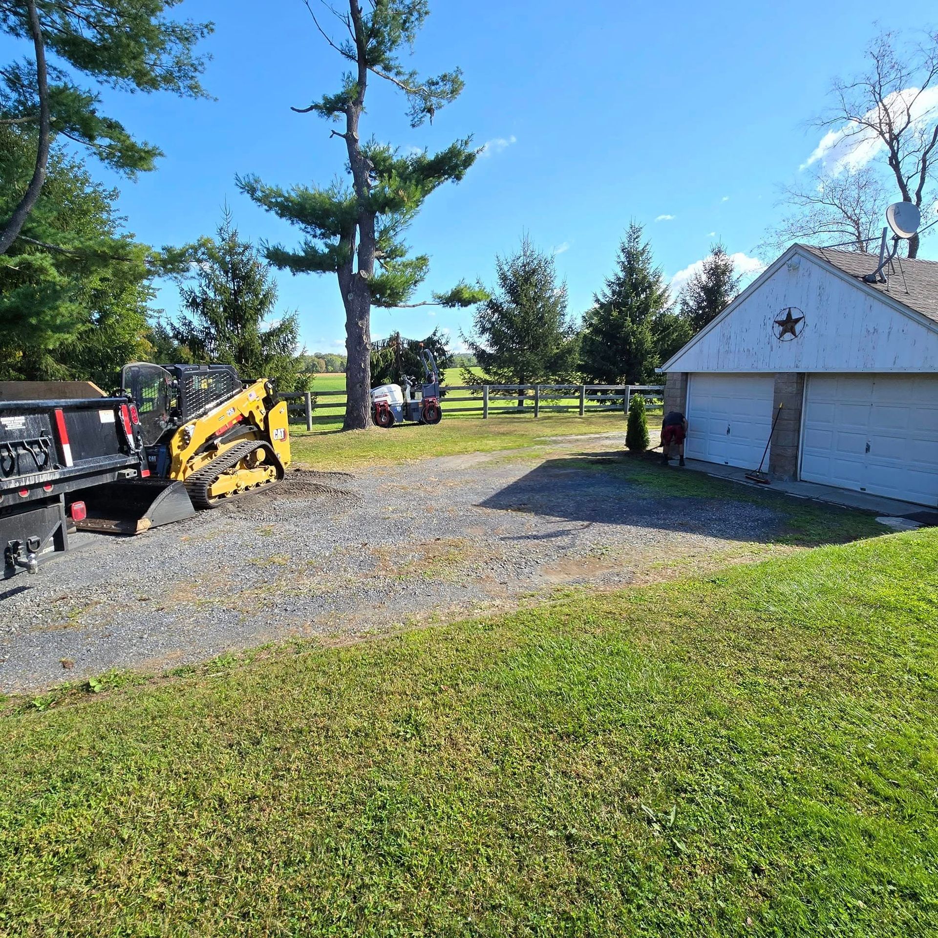 A tow truck is parked in front of a garage