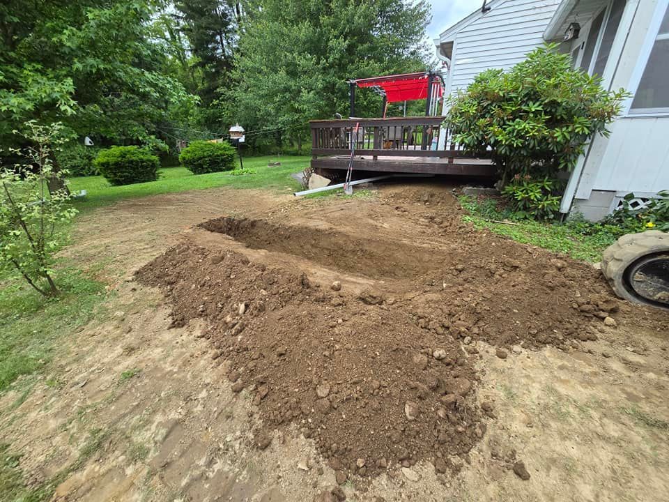A pile of dirt is sitting in front of a house.