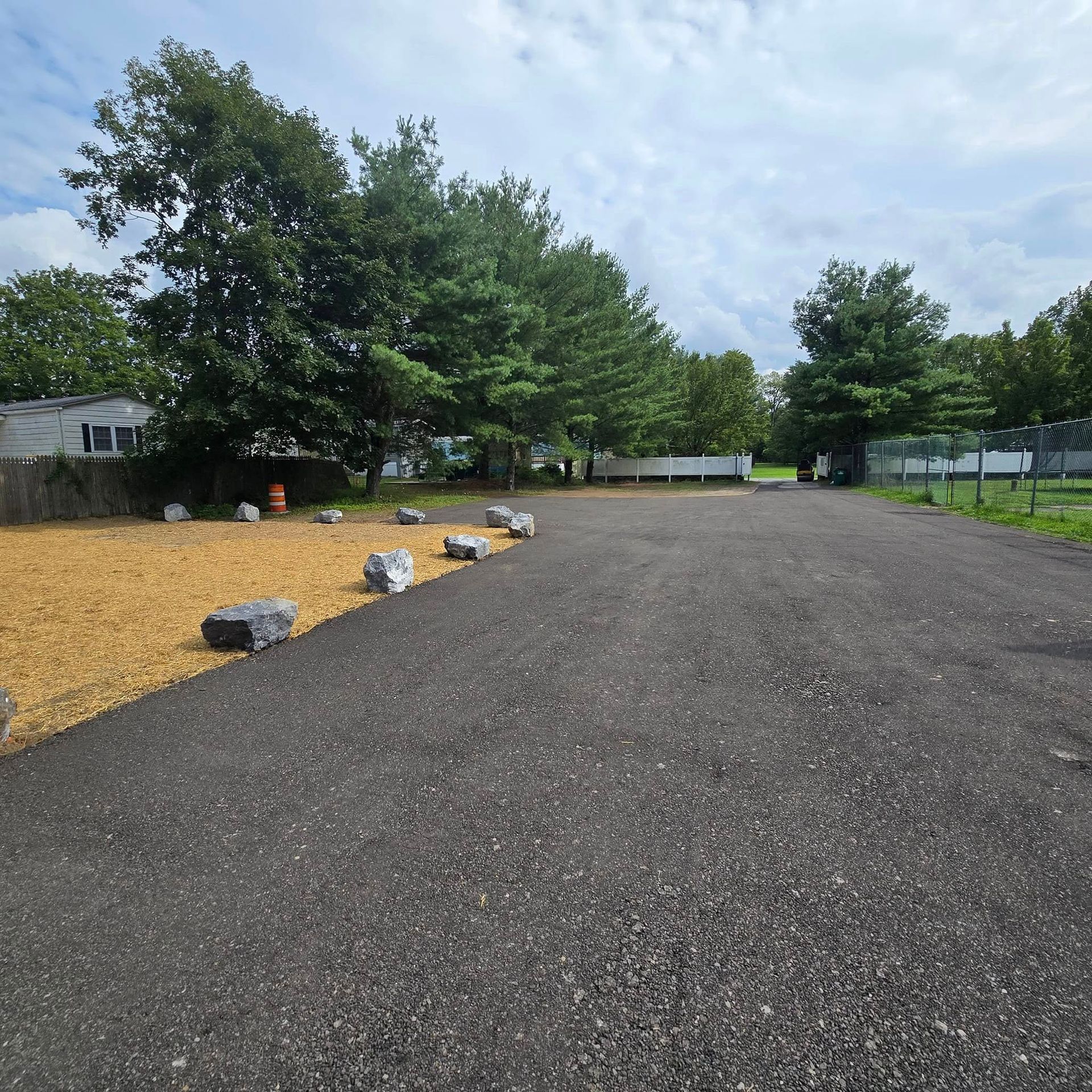 A road with a lot of rocks on the side of it