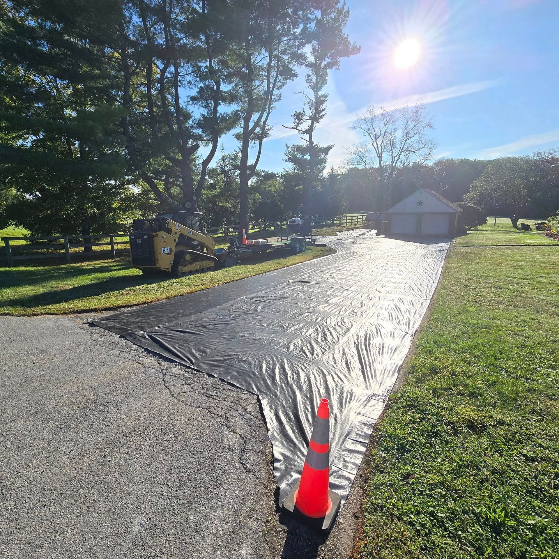 A road with a cone on the side of it