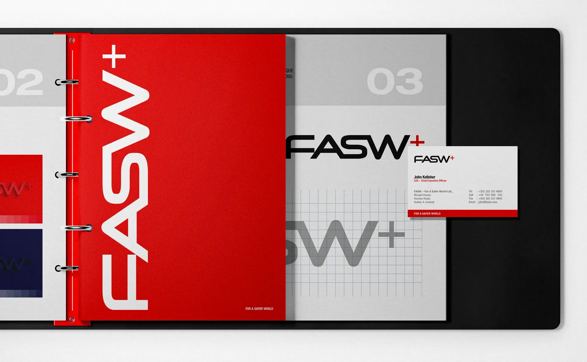 Red binder open to reveal pages with the 