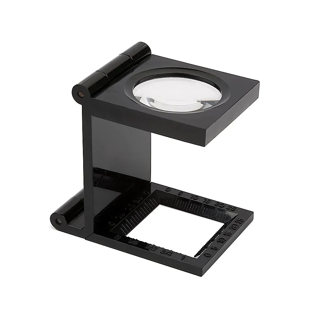 Black rectangular stand magnifier with a clear lens.