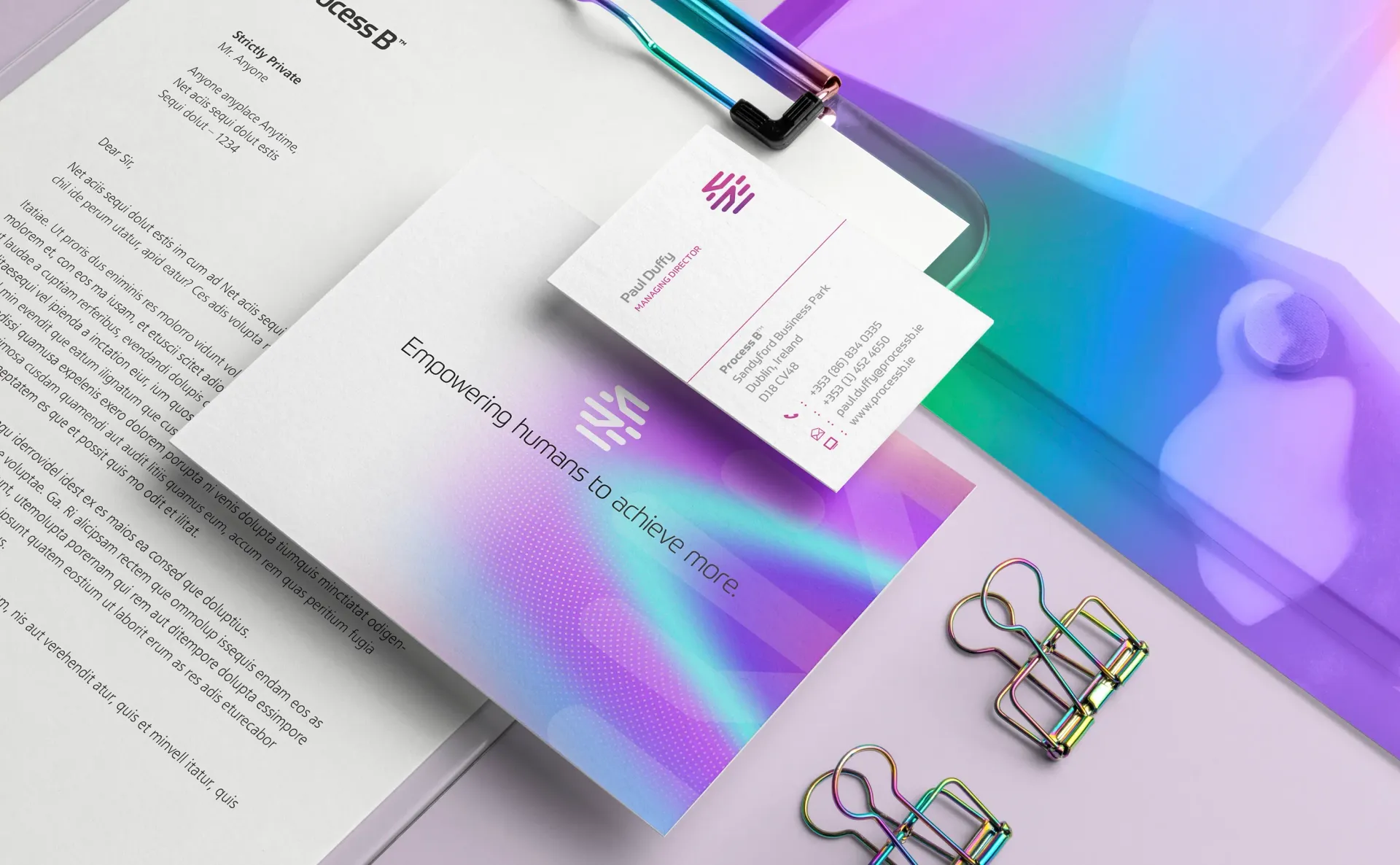 Stationery mockup with business cards, document, and iridescent accents.