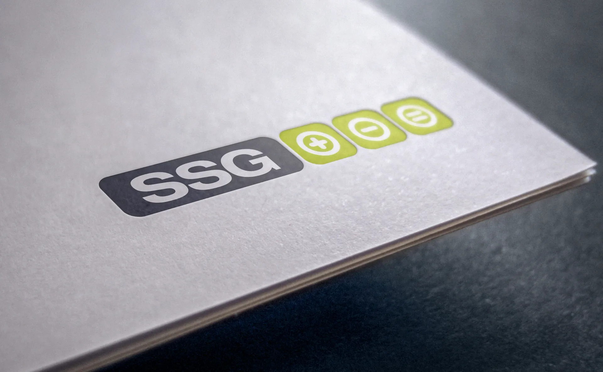 Logo on paper stack: 