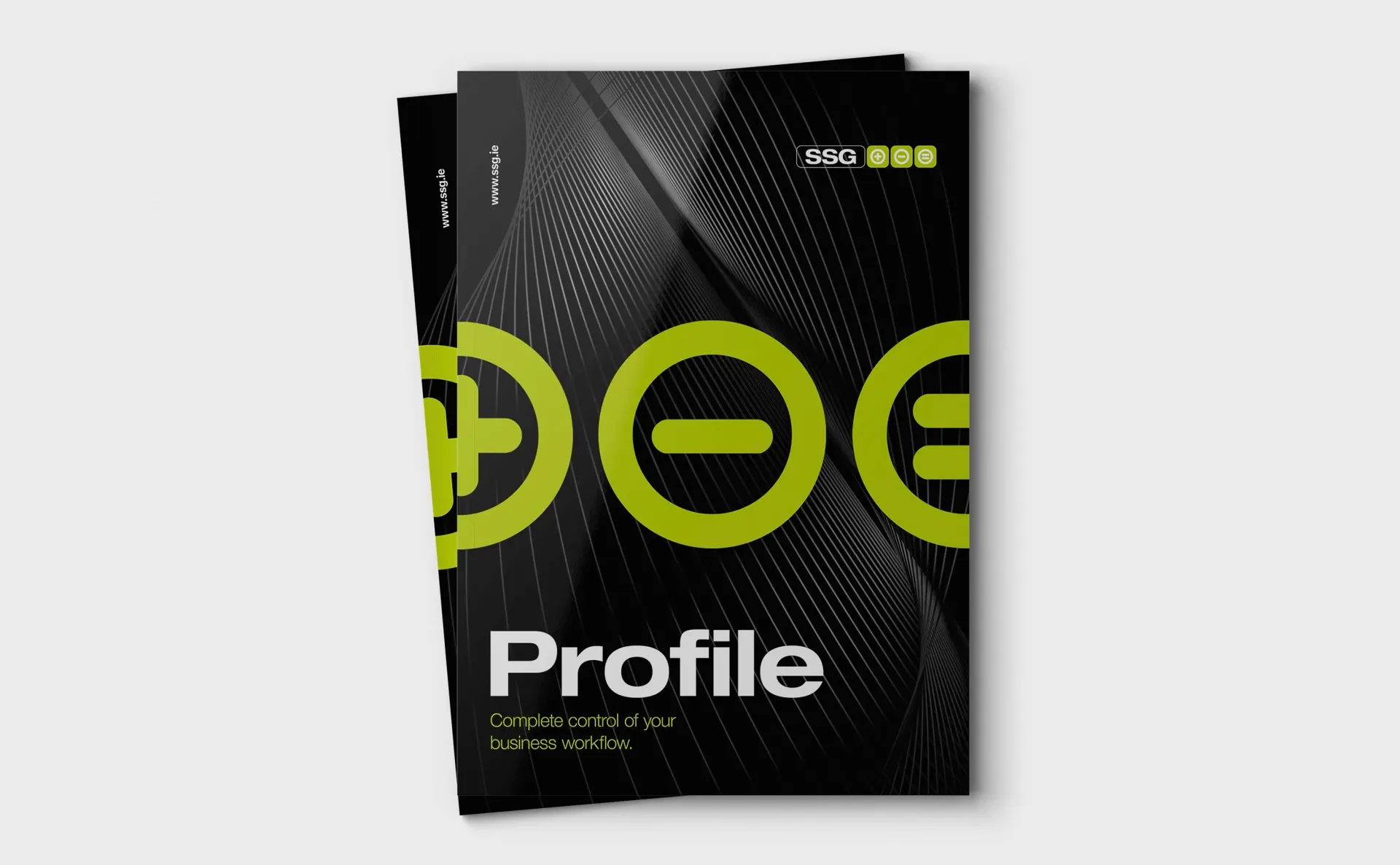 Brochure with a black cover, green plus, minus, and equal signs, and the word 