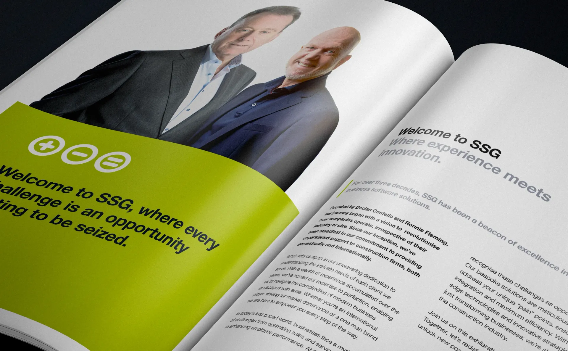 Open magazine with two men on the left and text on right page. Green and white color scheme.