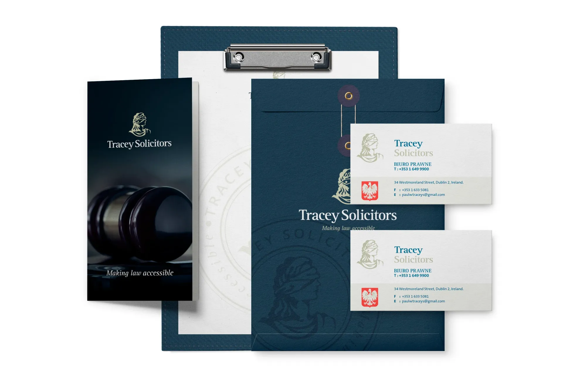 Stationery set: business cards, brochure, clipboard, and folder in navy blue with logo.