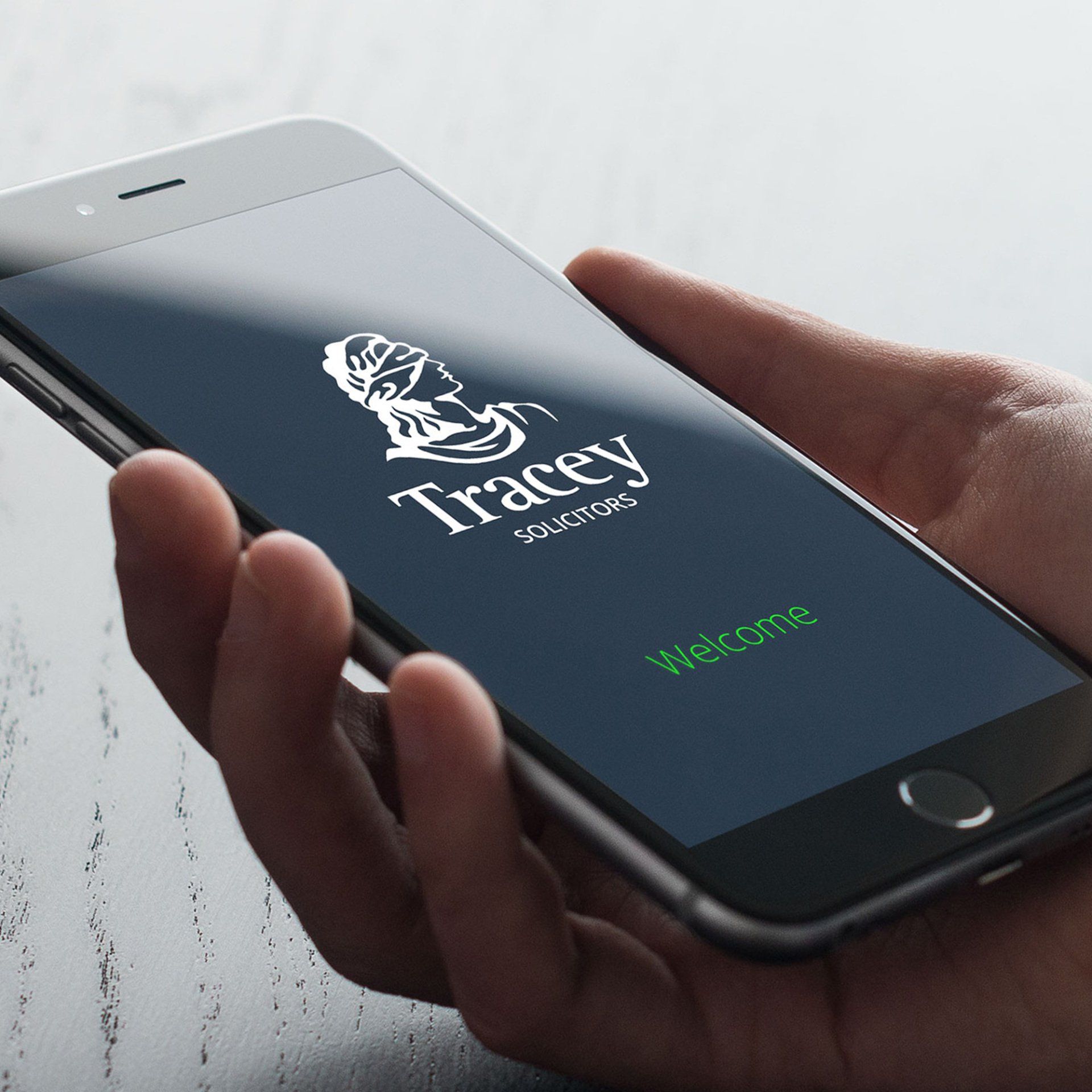 Hand holding a smartphone displaying the 