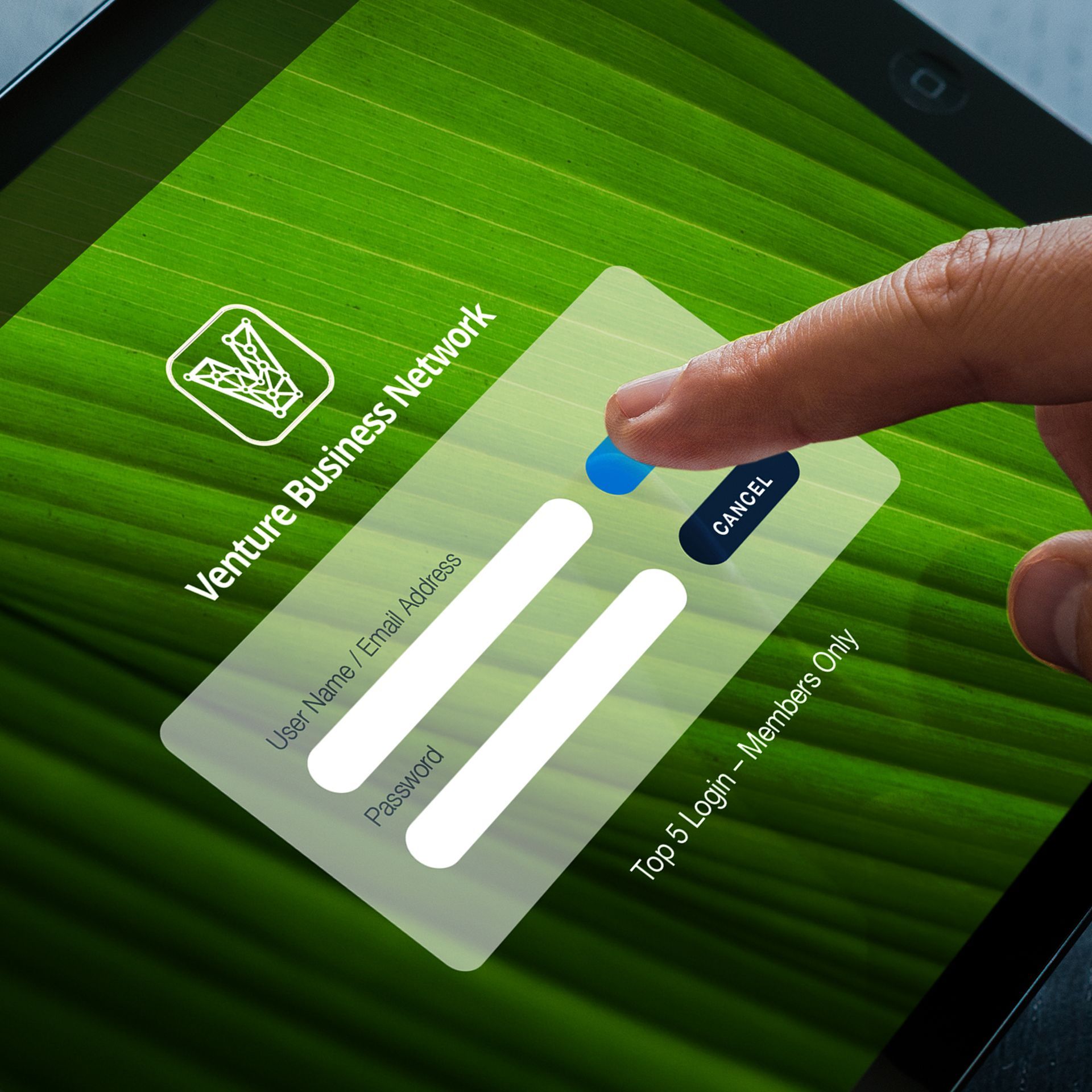 Hand touching a tablet screen with login fields for 