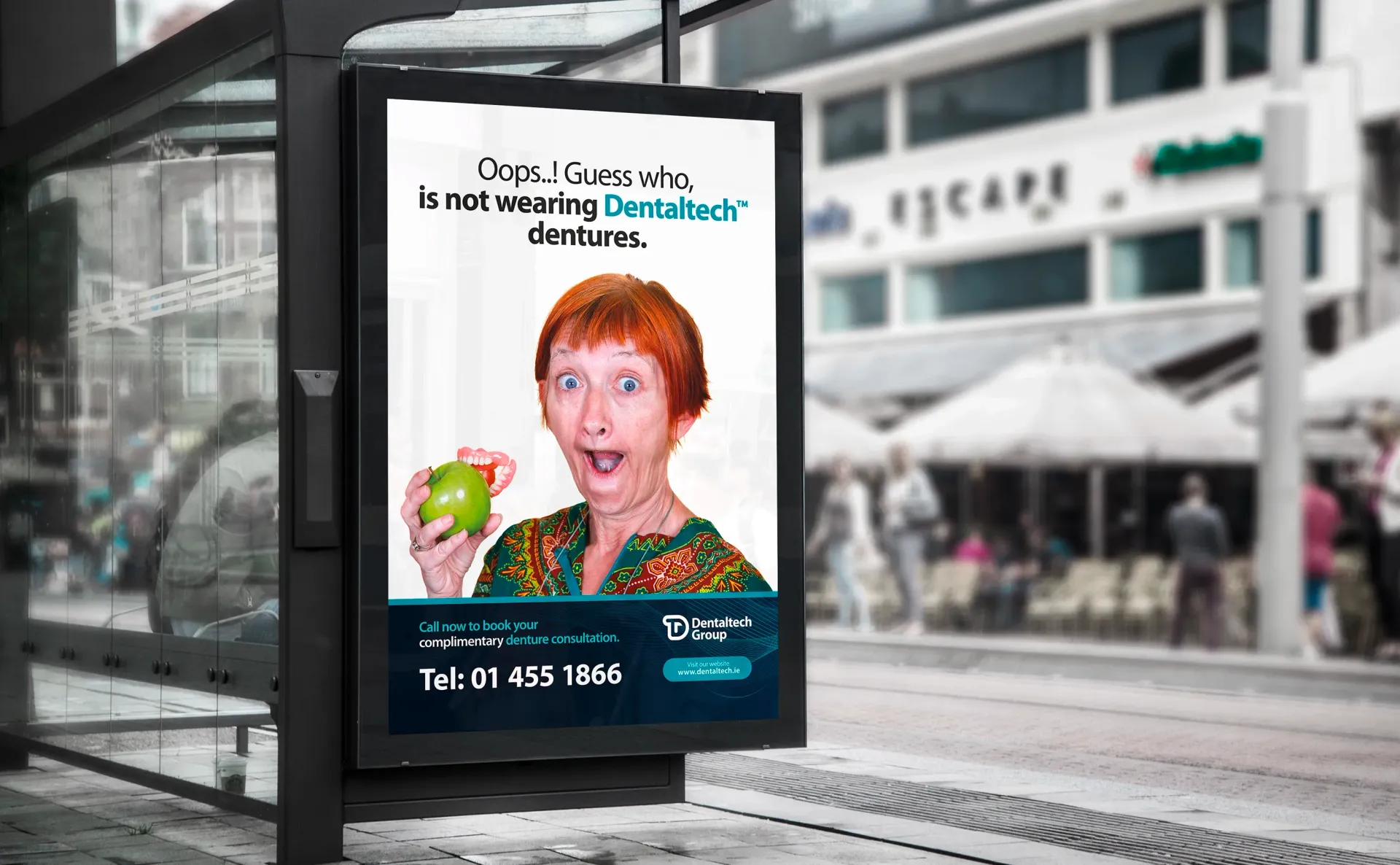 Billboard ad: woman holding apple, surprised expression, 