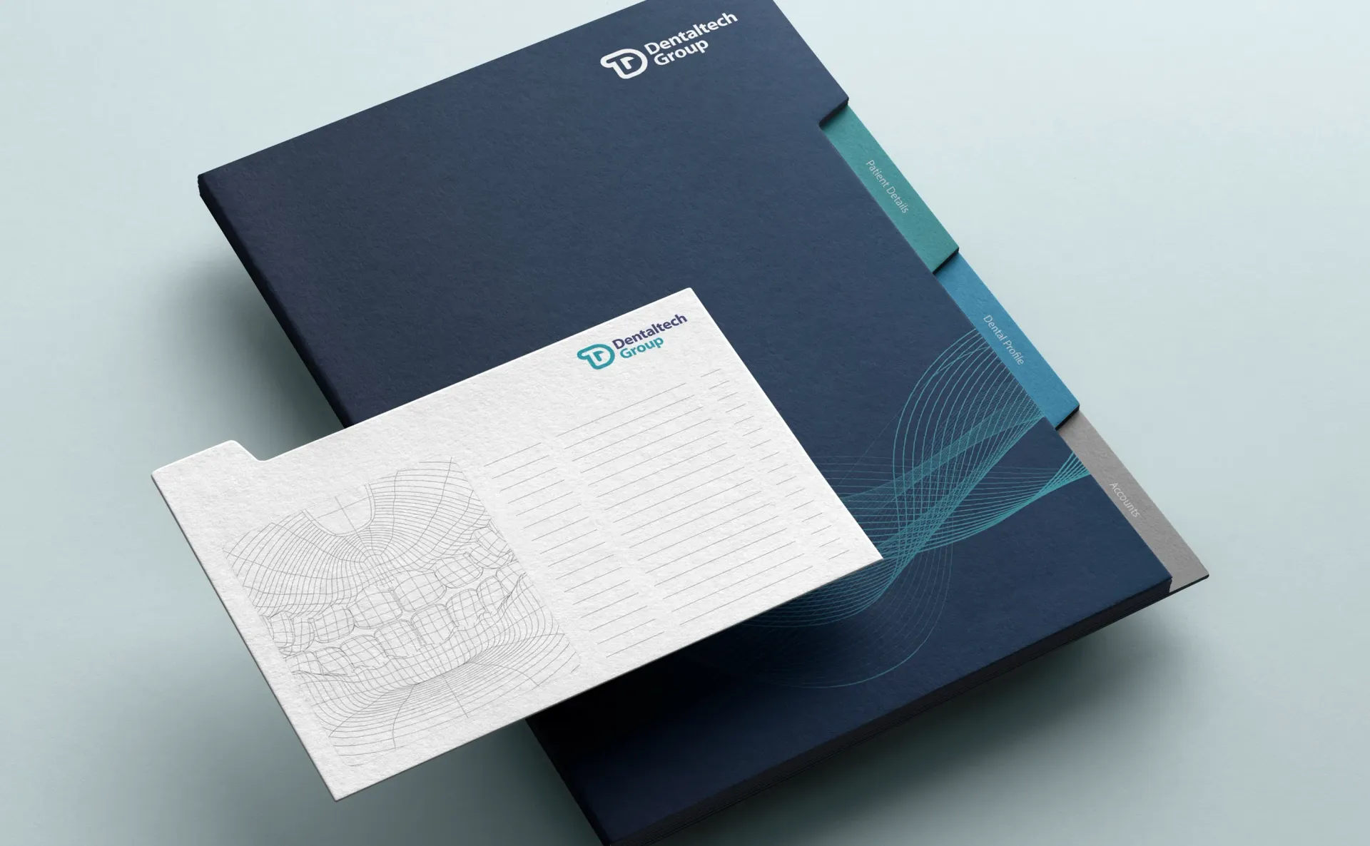 Dark blue presentation folder with white envelope, both with company logo and design.