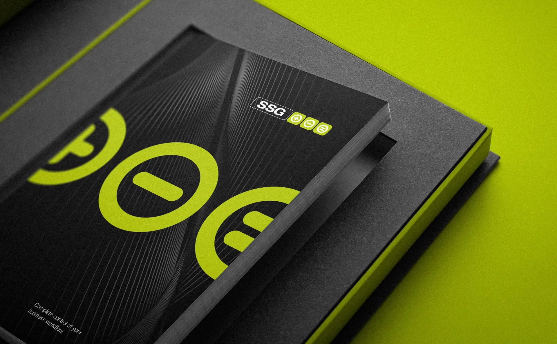 Black and yellow booklet with geometric logo and text, in a black box, against a yellow background.