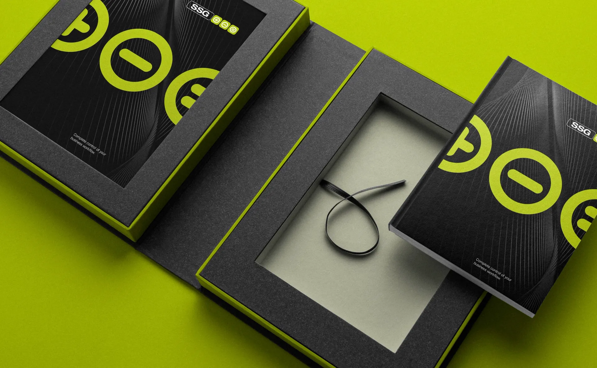 Black and neon green box set with a necklace, against a lime green background.