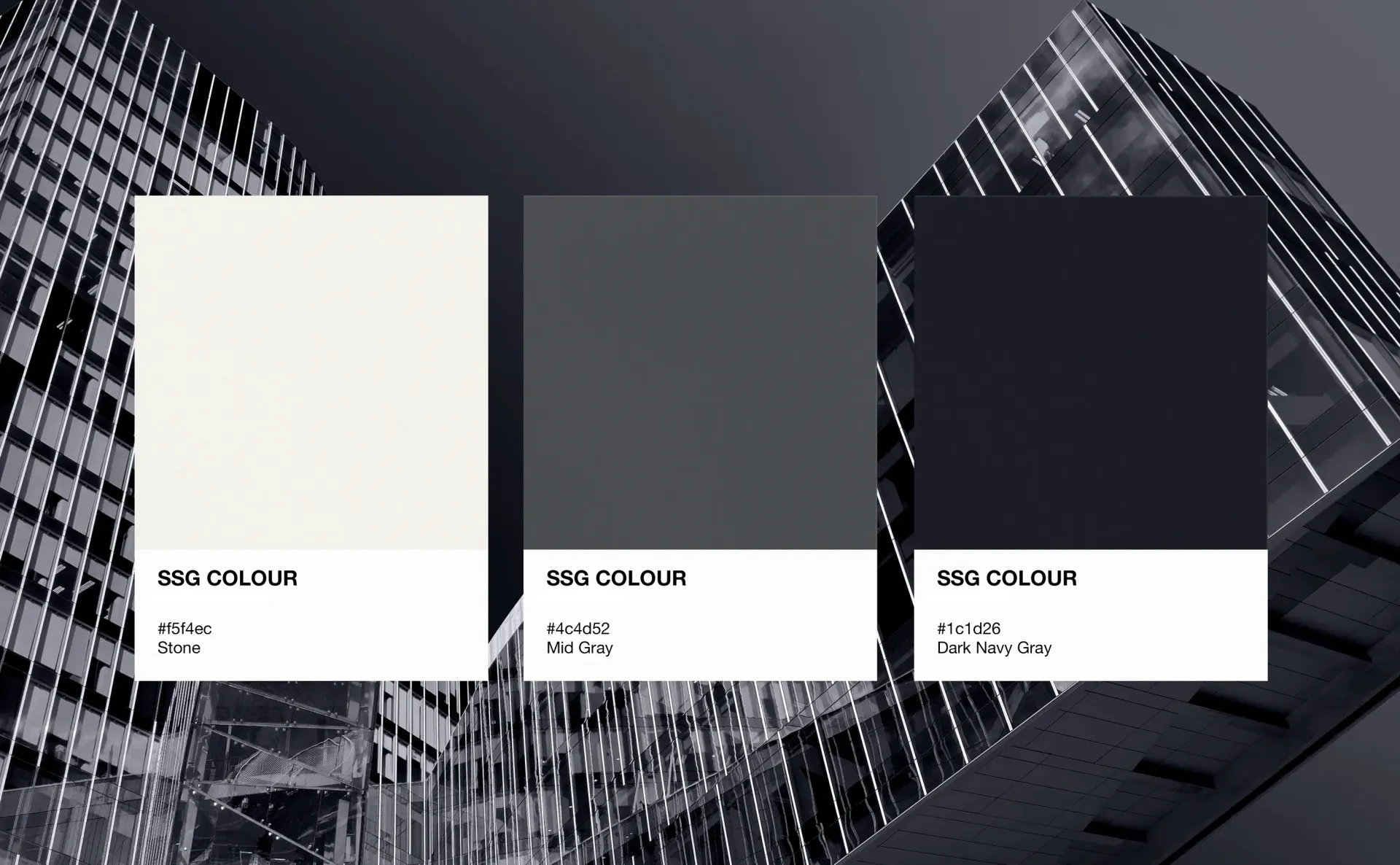 Color palette with white, grey, and dark grey squares on a grayscale building background.
