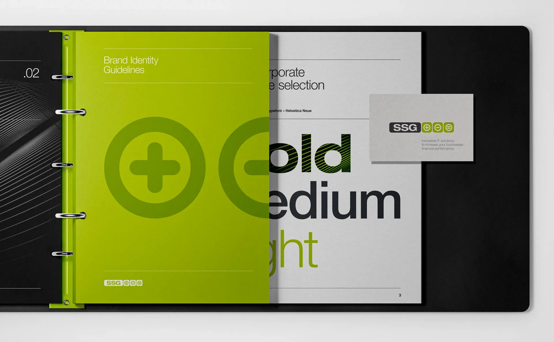Black binder with green elements: logo, text, and business card on a white page.