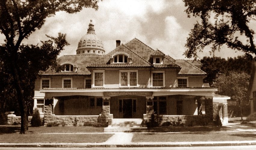 A large house with a dome on top of it