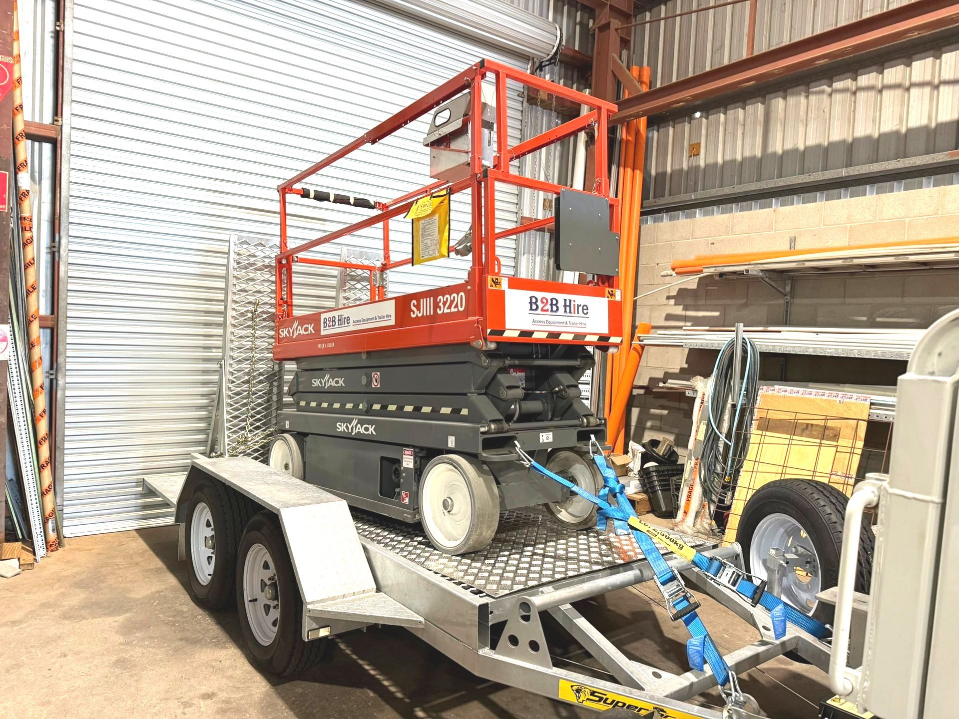A Crane Is Being Used To Paint The Side Of A Building — B2B Hire In Garbutt, QLD