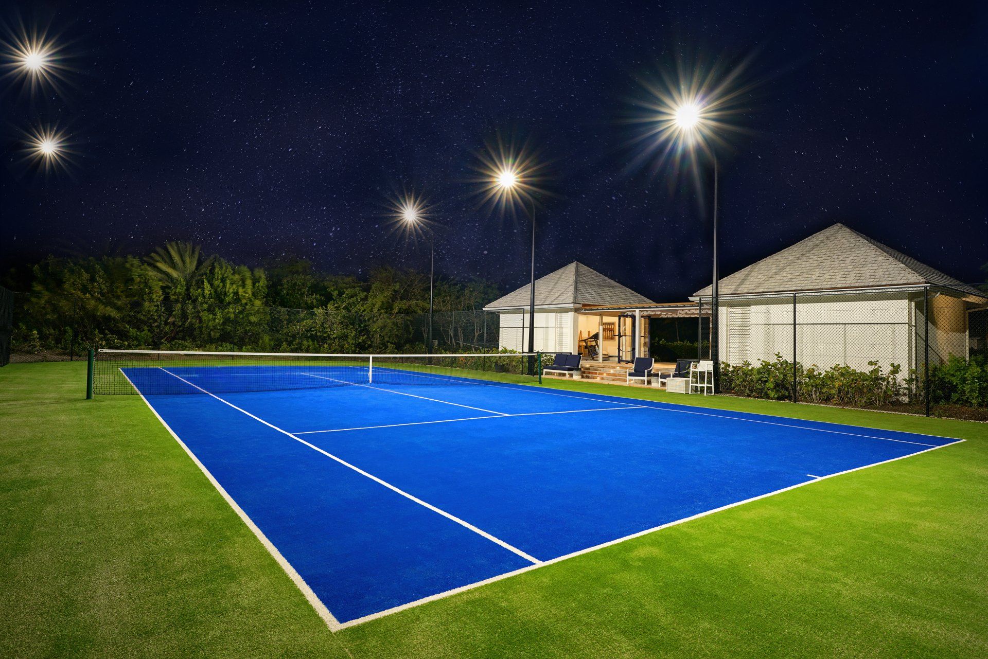 Tŷ Compton Jumby Bay island  lighted tennis court