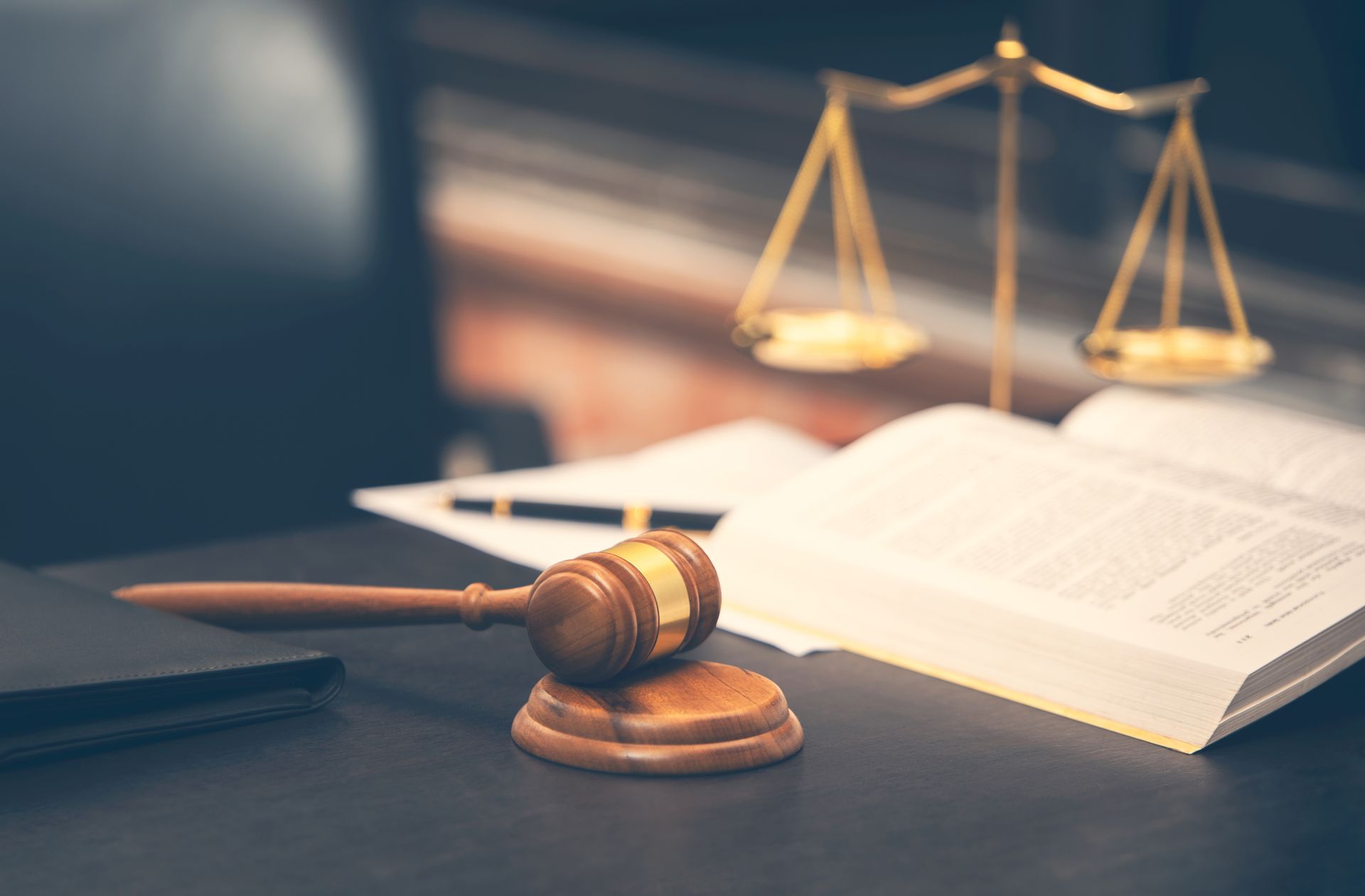 judge gavel with law book on wooden table