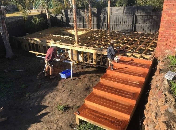 Group of People Are Working on A Wooden Deck — Flintoff Constructions in Charlemont, VIC