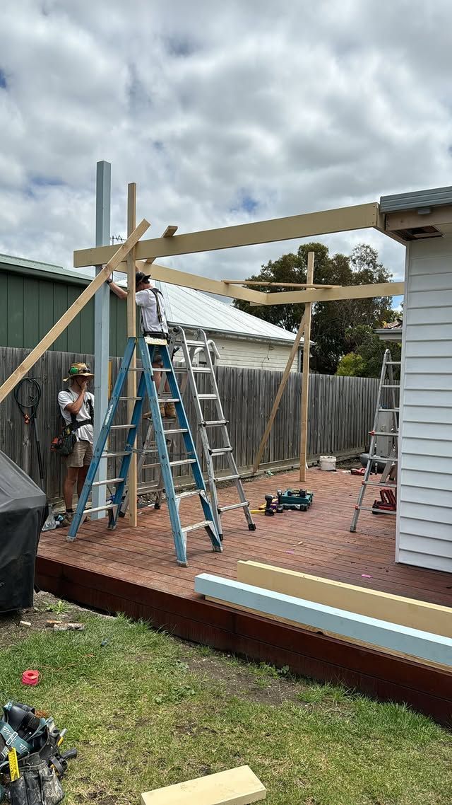 Two men are working on building an outdoor deck — Flintoff Constructions in Charlemont, VIC