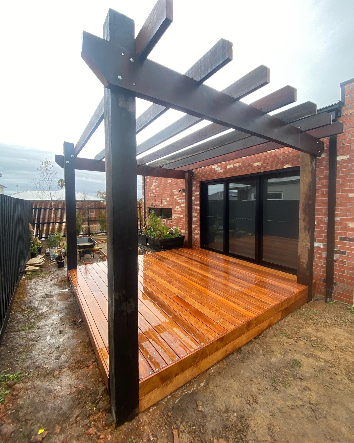 Wooden Deck and Pergola with Dark Stain — Flintoff Constructions in Armstrong Creek, VIC