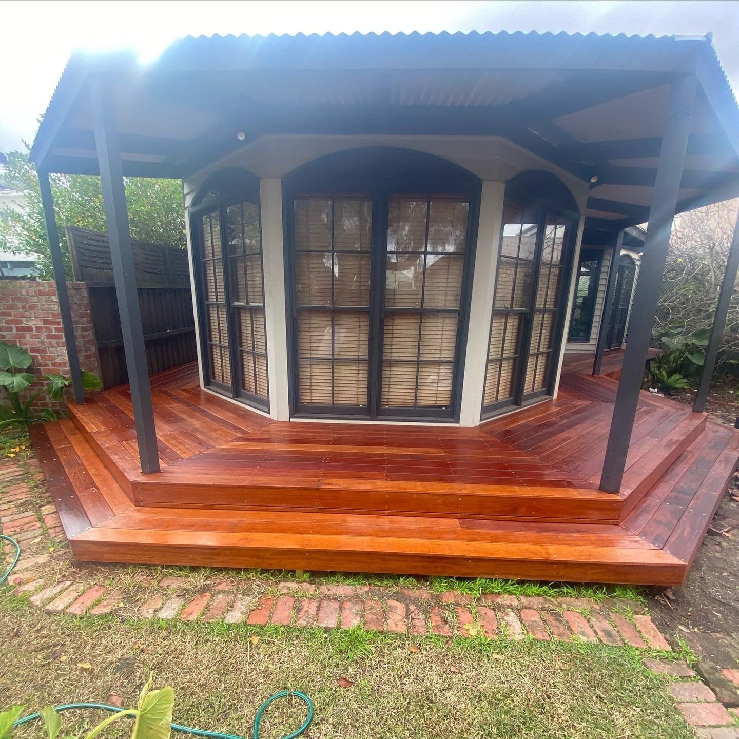 Brick House with A Covered Walkway Leading to A Pool — Flintoff Constructions in Charlemont, VIC