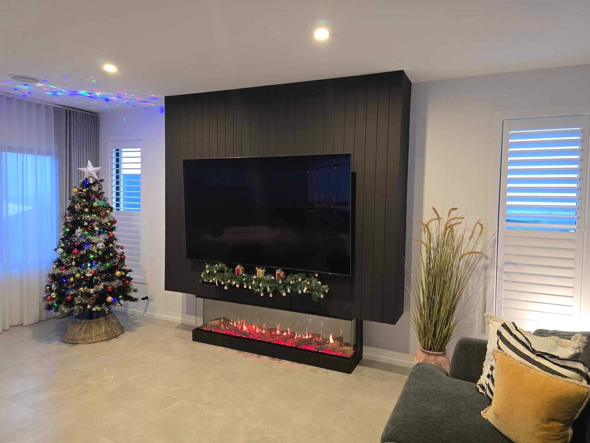 Living Room with Christmas Tree and Large Tv — Flintoff Constructions in Armstrong Creek, VIC