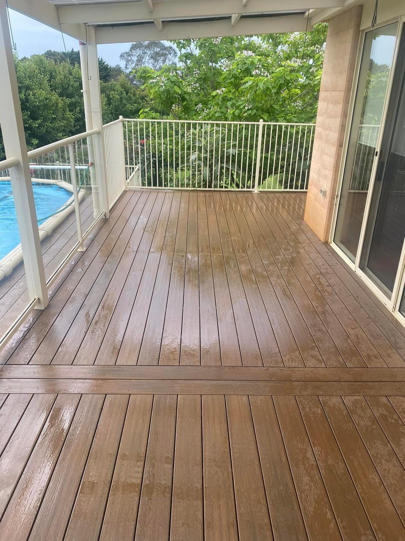 Wooden Deck Is Sitting in Front of A Brick House — Flintoff Constructions in Charlemont, VIC