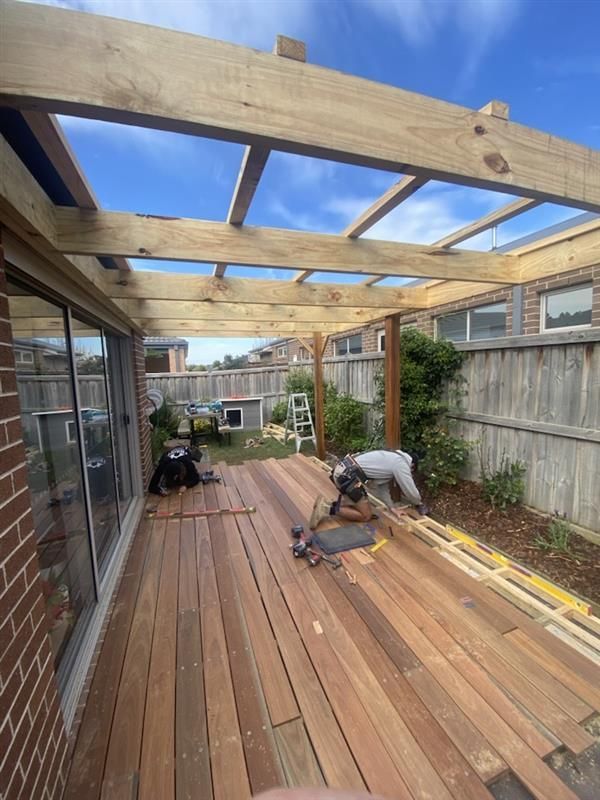 A Pergola Is Sitting in Front of A Brick House — Flintoff Constructions in Charlemont, VIC