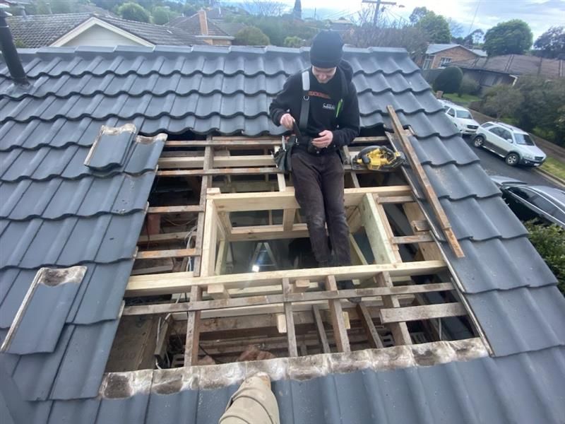 Two Men Are Working on The Roof of A Building — Flintoff Constructions in Charlemont, VIC