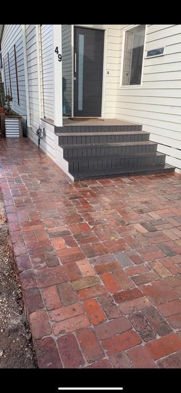 A paved driveway with a small gravel garden bed — Flintoff Constructions in Charlemont, VIC