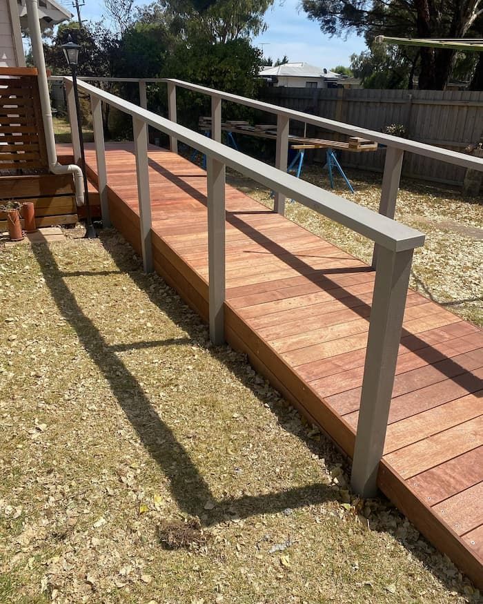 Wooden Ramp with A Metal Railing in A Yard — Flintoff Constructions in Charlemont, VIC