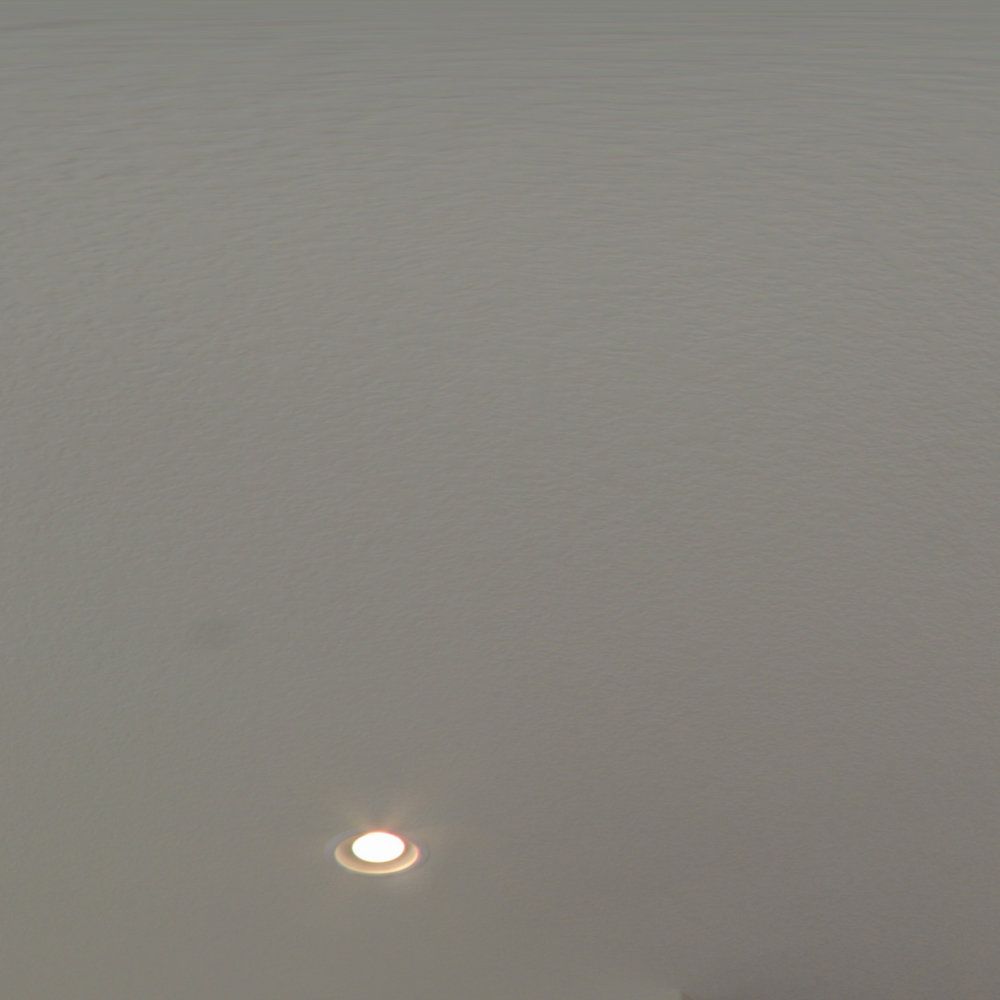 A light is shining through a hole in the ceiling.