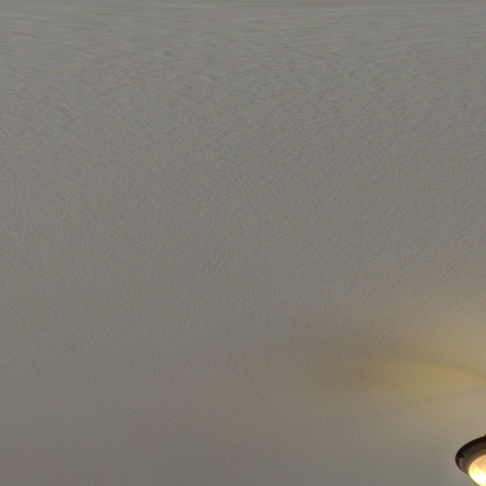 A ceiling fan is hanging from the ceiling of a room.