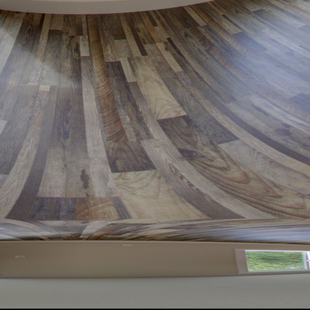 A close up of a wooden floor in a room with a window.