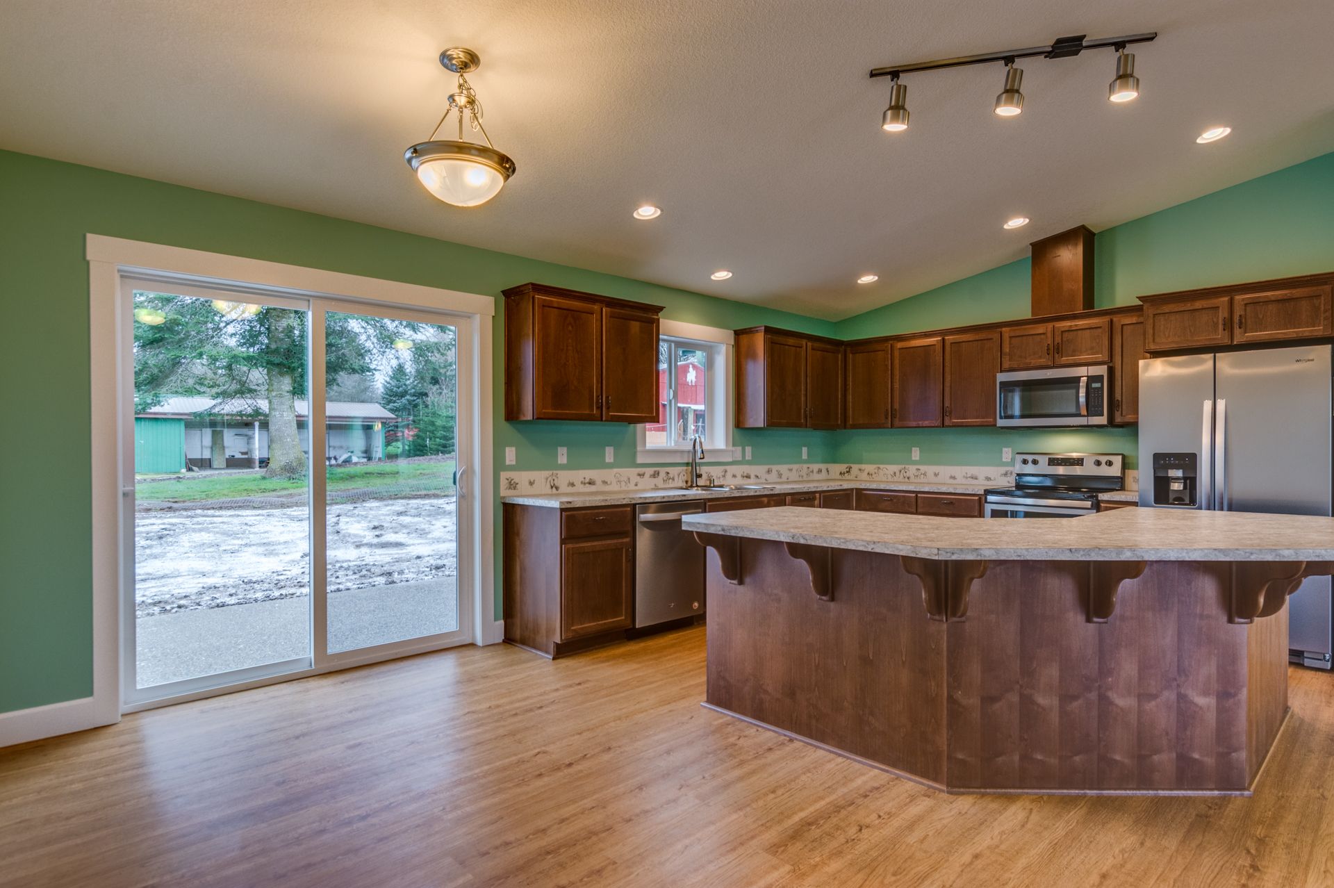There is a large island in the middle of the kitchen.