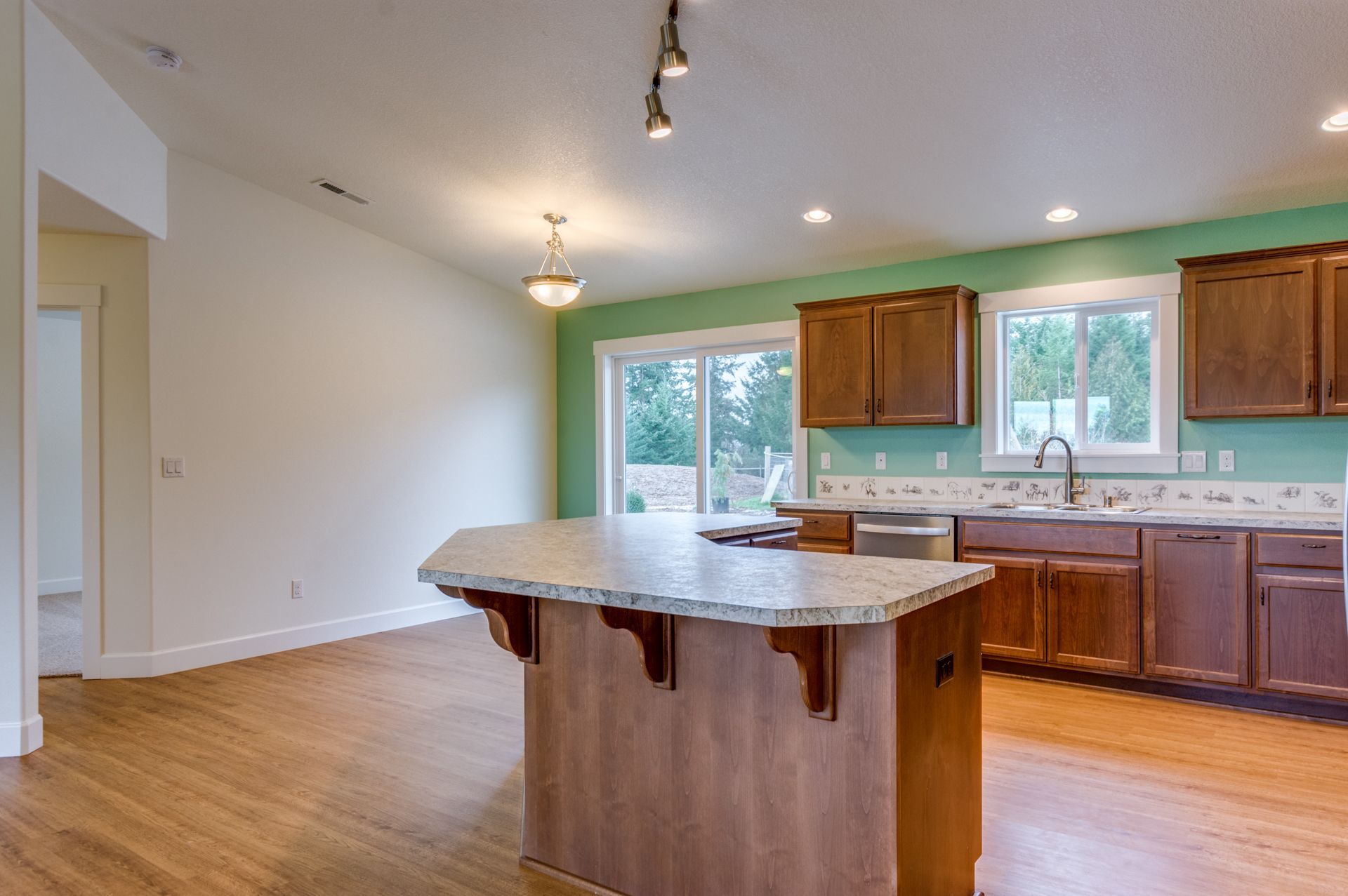 There is a large island in the middle of the kitchen.